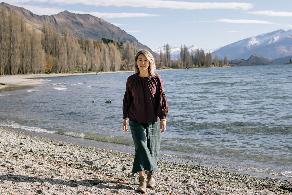 Dr Jin Ong by a lake in Wanaka New Zealand